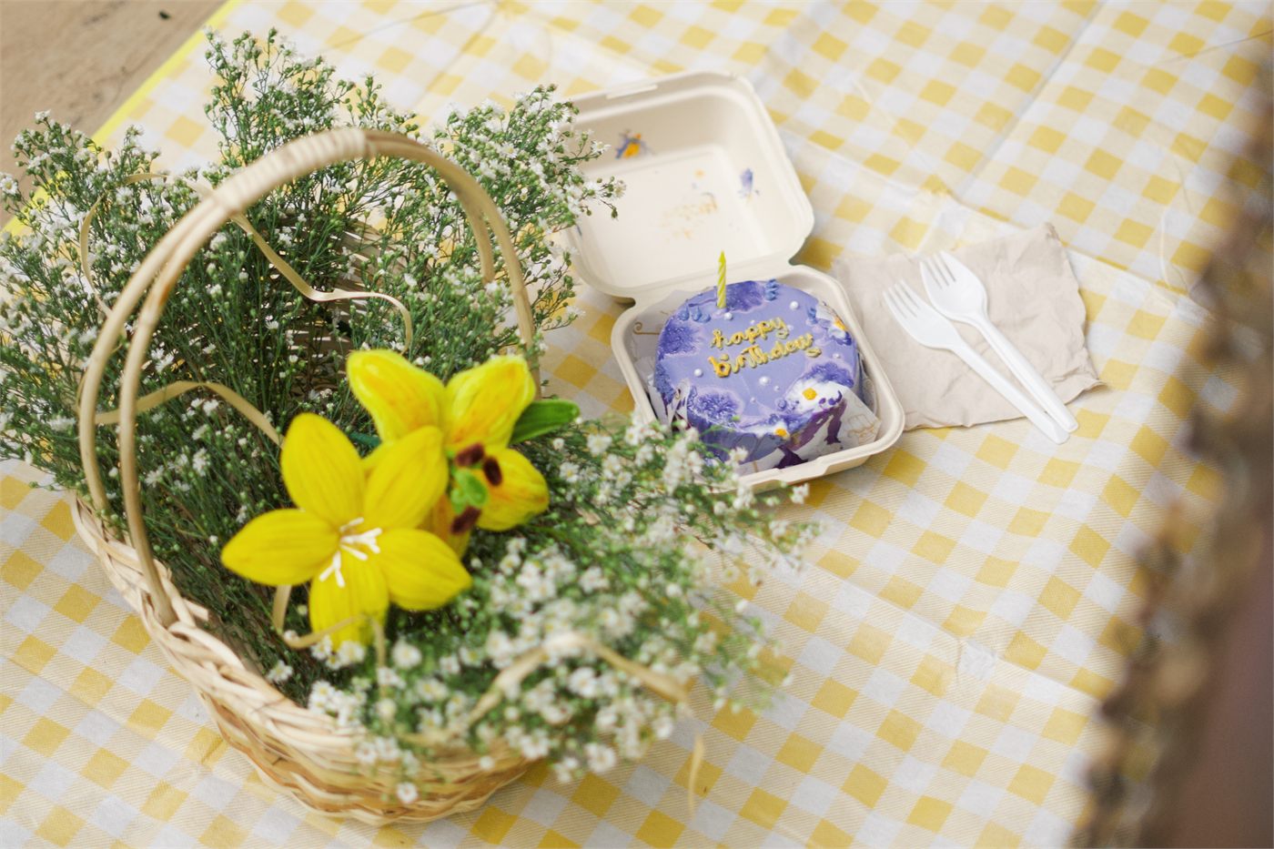 A flower-filled picnic basket and Giana's purple keepsake